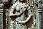 Ta Prohm temple - devatas sculpted on the gallery walls 